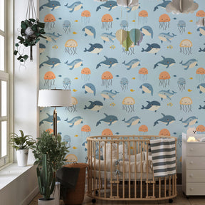 Dolphins and jellyfish wallpaper transforming playroom into aquatic adventure space