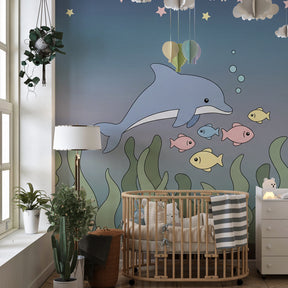Underwater dolphin wallpaper creating magical marine atmosphere in kids bedroom