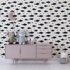 Underwater themed mural wallpaper creating aquatic playroom atmosphere with swimming fish designs