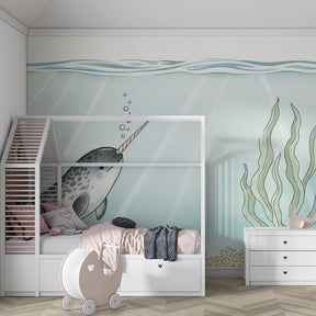 Marine themed narwhal mural wallpaper adding magical ocean atmosphere to kids playroom
