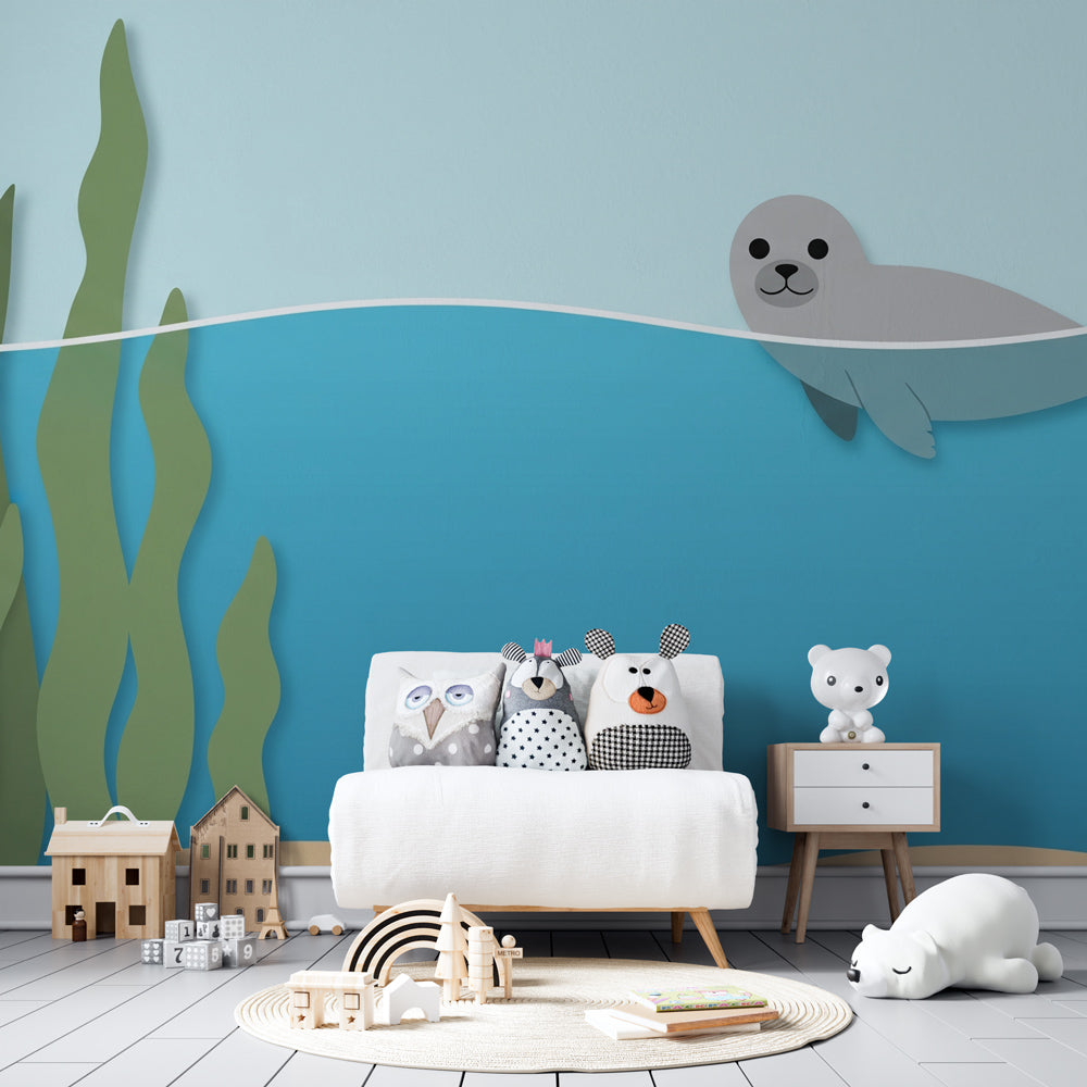Playful seal ocean wallpaper installed in colorful children's playroom setting