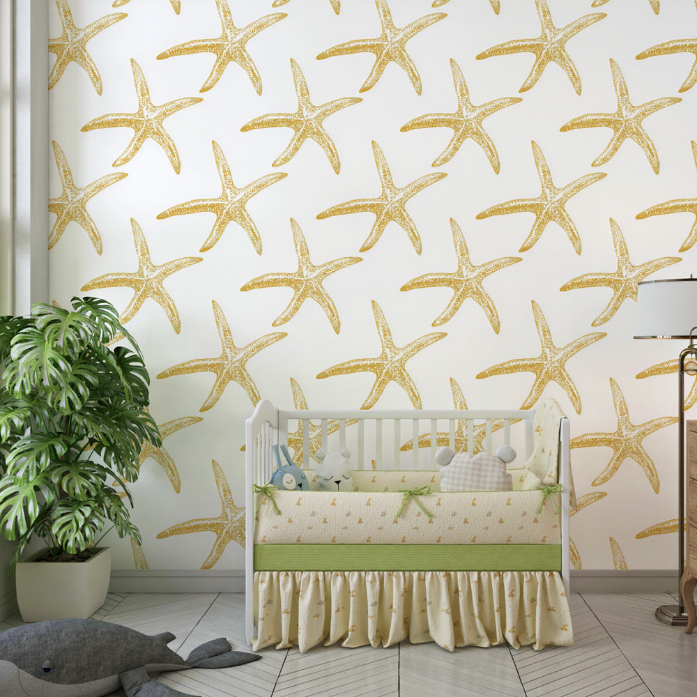 Maritime starfish wallpaper in kids playroom with ocean-themed furniture and toys