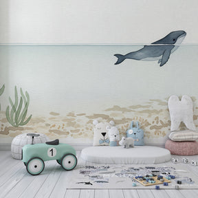 Maritime whale mural wallpaper transforming kids playroom into underwater sanctuary