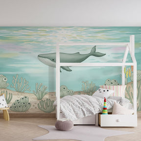 Majestic whale mural wallpaper with marine life creating educational kids playroom decor