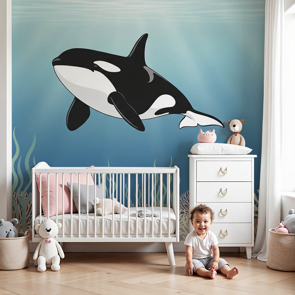 Kids-Mundo orca coral reef wall mural styled behind a cot in a bright playful nursery