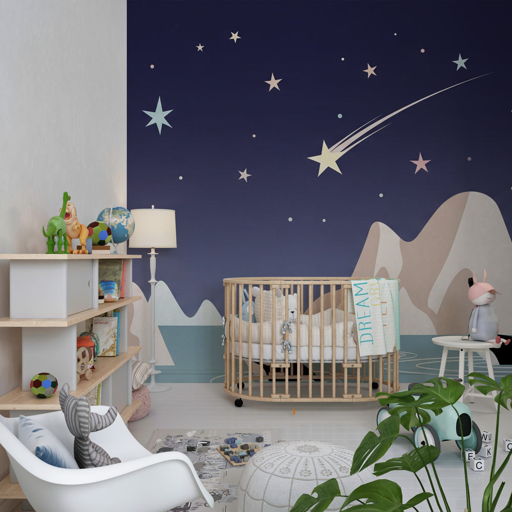 Ocean themed nursery featuring orca mural wallpaper with coral pink and blue tones