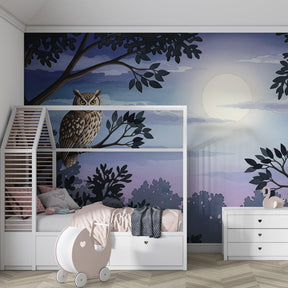 Forest owl mural wallpaper with blue purple tones in cozy kids room setting