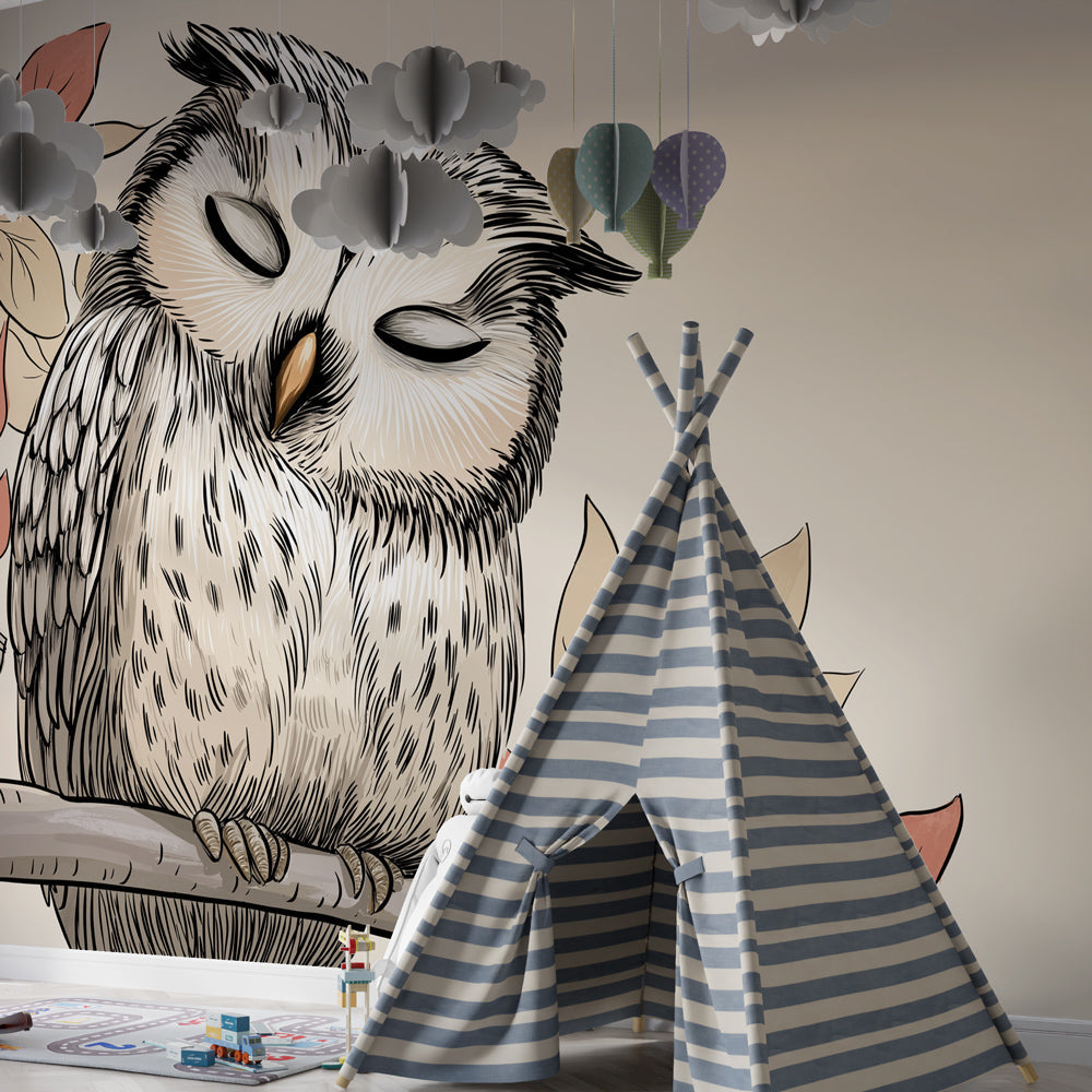 Soft woodland owl mural wallpaper complementing beige nursery theme with cozy reading corner