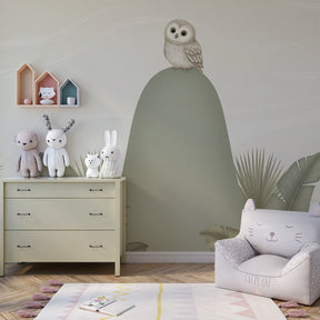Peaceful owl wallpaper transforming baby nursery with tropical leaves and gentle hills