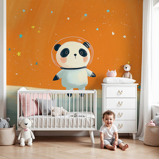 Kids-Mundo panda astronaut wall mural styled in a bold orange-accented nursery with a cot