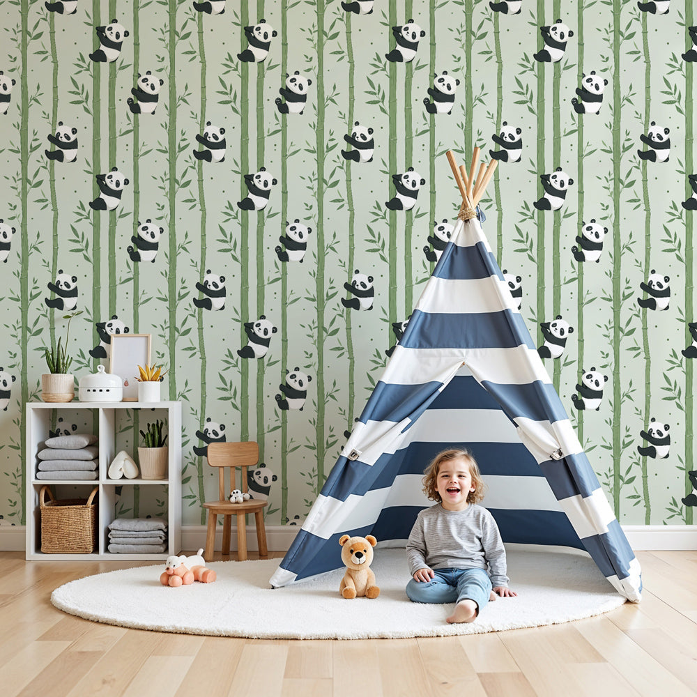 Kids-Mundo panda and bamboo wall mural in a soft sage-green nursery with a white cot and wooden rocking chair.