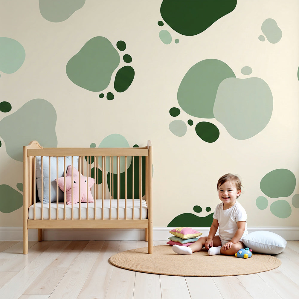 Kids-Mundo green paw print wall mural styled in a soft, natural nursery.