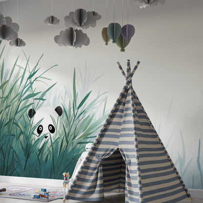 Kids-Mundo panda peeking through bamboo leaves mural covering a playroom wall behind toy shelves