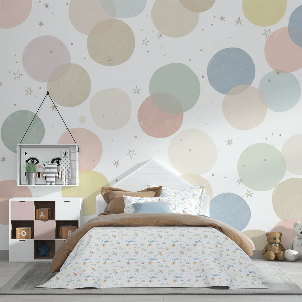 Kids-Mundo pastel circle pattern mural covering a feature wall in a gender-neutral kids' bedroom