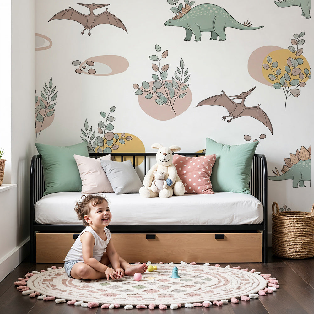 Kids-Mundo pastel dinosaur wall mural styled in a light nursery with white cot and soft rug.
