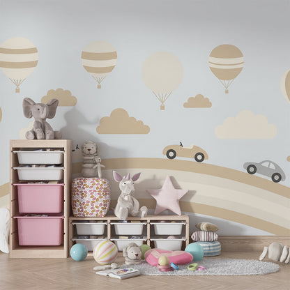 Kids-Mundo car and balloon rainbow mural brightening a playroom accent wall for children