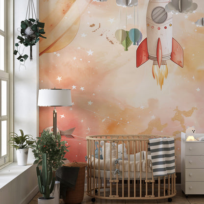 Kids-Mundo soft watercolour rocket wall mural in a playroom, with gold-flecked clouds and a pale moon