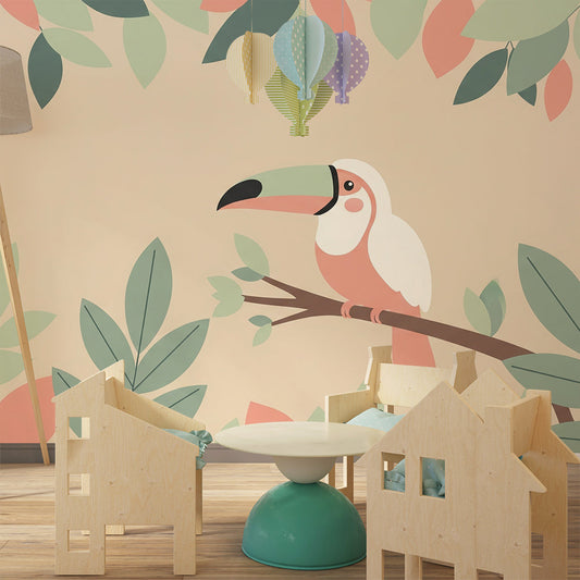 Kids-Mundo toucan wall mural in a kids' bedroom, gentle beige tones with pastel leaf branches around the bird.
