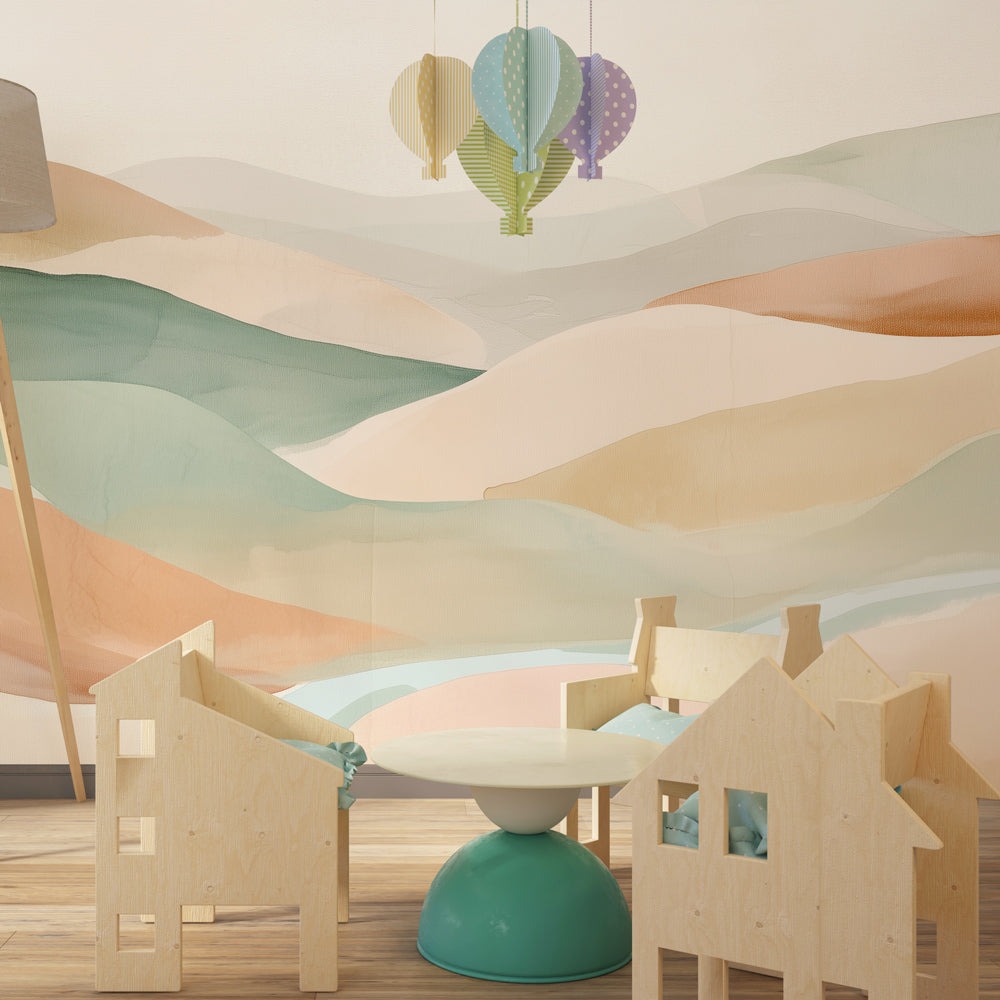 Kids-Mundo pastel hills wall mural covering a feature wall in a soft, colourful kids bedroom