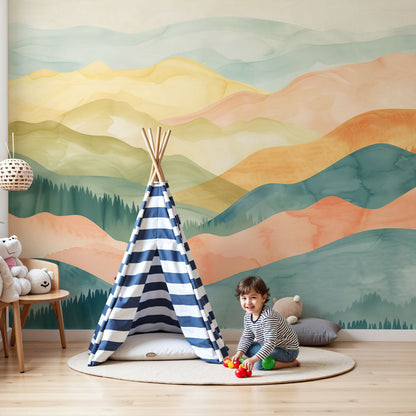 Kids-Mundo pastel watercolour mountain wall mural behind a cot in a soft baby nursery