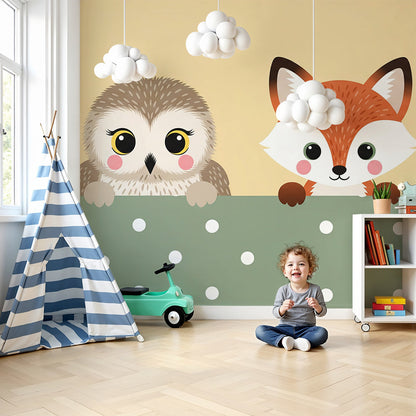 Kids-Mundo owl and fox wall mural styled above a cot in a warm, playful nursery