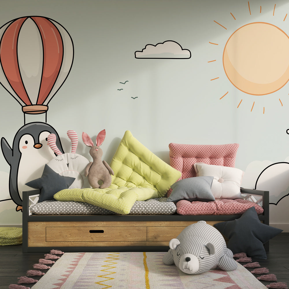 Adventure-themed penguin mural wallpaper transforming kids playroom with sky design