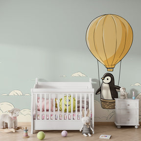 Sky adventure wallpaper featuring penguin in hot air balloon for children's bedroom decor
