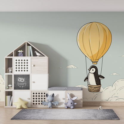 Kids-Mundo penguin balloon mural fitted in a playroom with a warm golden balloon and soft sky