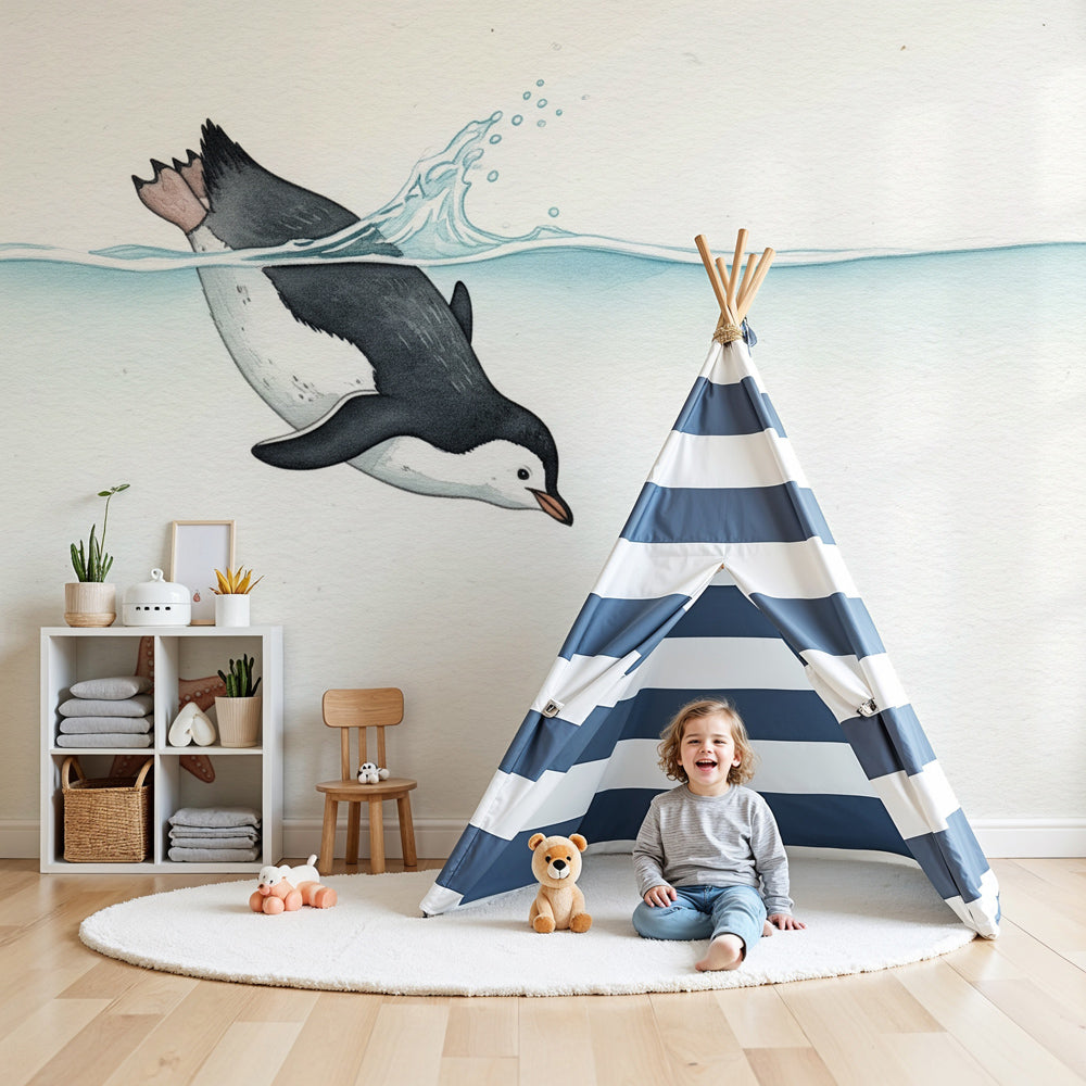 Swimming penguin mural wallpaper creating serene ocean theme in modern baby nursery by Kids-Mundo