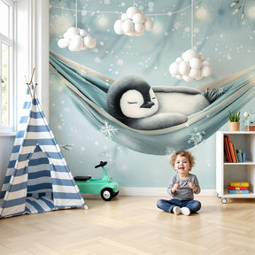 Baby penguin mural wallpaper in cozy nursery with blue winter theme by Kids-Mundo