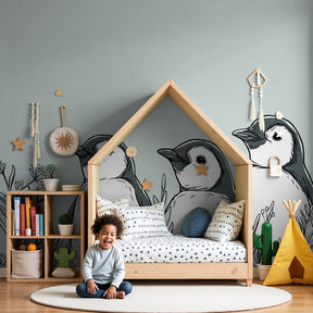 Penguin mural wallpaper creating serene nursery atmosphere with soft green tones by Kids-Mundo