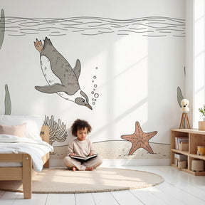 Penguin underwater mural wallpaper in modern nursery with coral ocean theme by Kids-Mundo