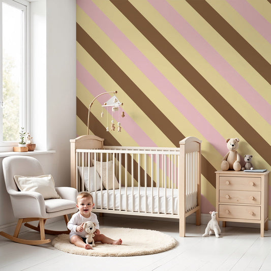 Kids-Mundo pink, beige and brown diagonal stripe wall mural in a soft nursery bedroom setting