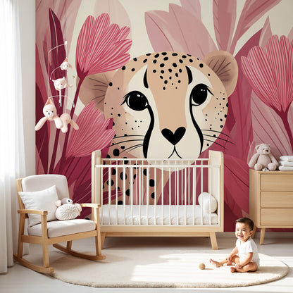 Kids-Mundo pink jungle leopard cub wall mural styled in a soft pastel nursery beside a white cot.