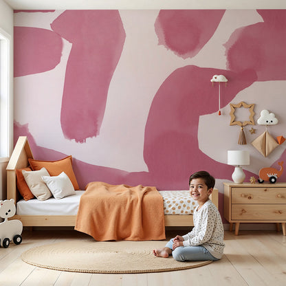 Kids-Mundo abstract pink watercolour wall mural in a calm nursery with a cot and soft rug