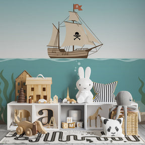 Maritime themed mural wallpaper transforming kids playroom into pirate treasure cove