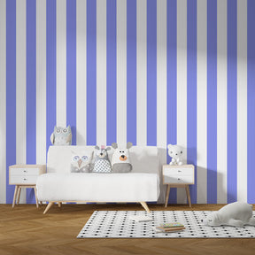 Soft violet striped mural wallpaper paired with light furniture in kids room