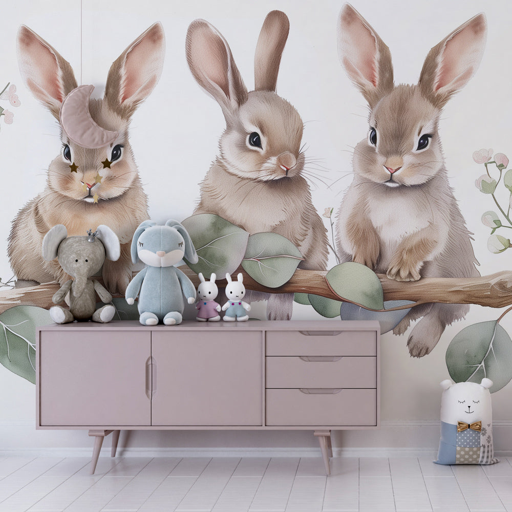 Baby animal mural wallpaper with three rabbits on branch in cozy toddler bedroom