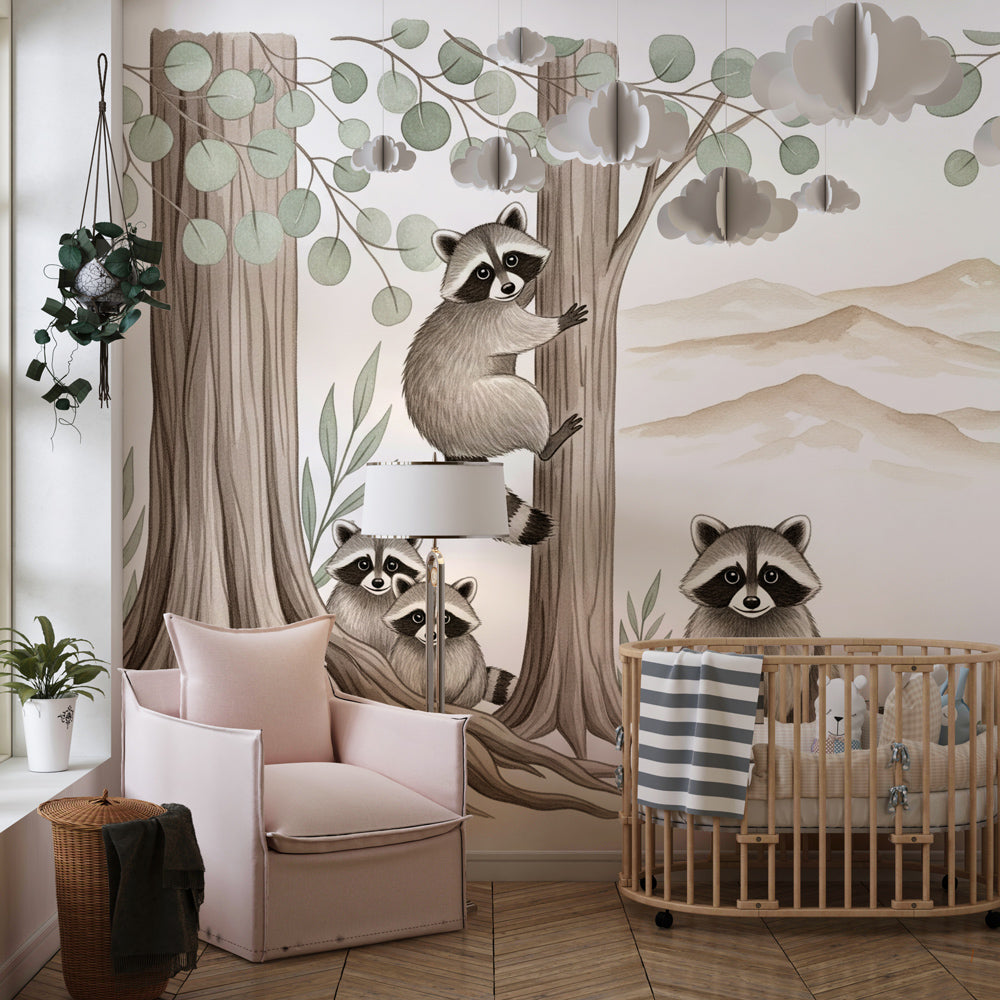 Kids-Mundo raccoon family tree mural on a playroom wall behind a soft play rug