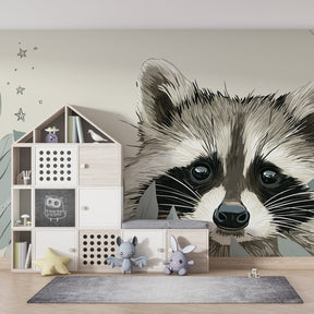 Curious raccoon wallpaper transforming baby bedroom with soft green and beige woodland design