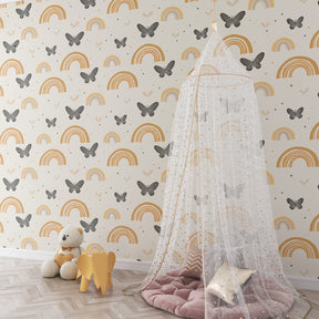 Pastel rainbow and butterfly wallpaper creating magical atmosphere in children's bedroom