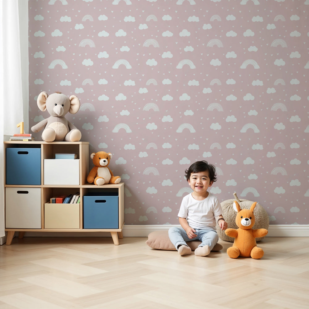 Rainbow cloud mural wallpaper in soft pink nursery with white crib by Kids-Mundo