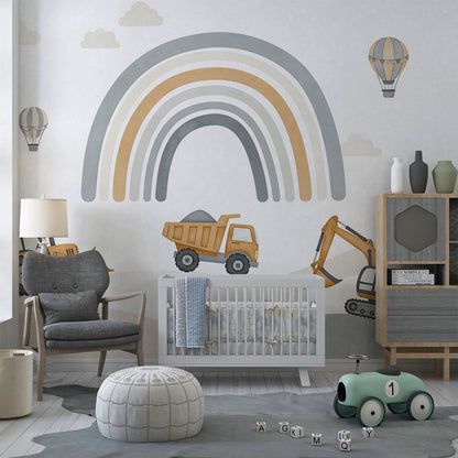Kids-Mundo rainbow digger wall mural in a playroom with toy trucks on the floor