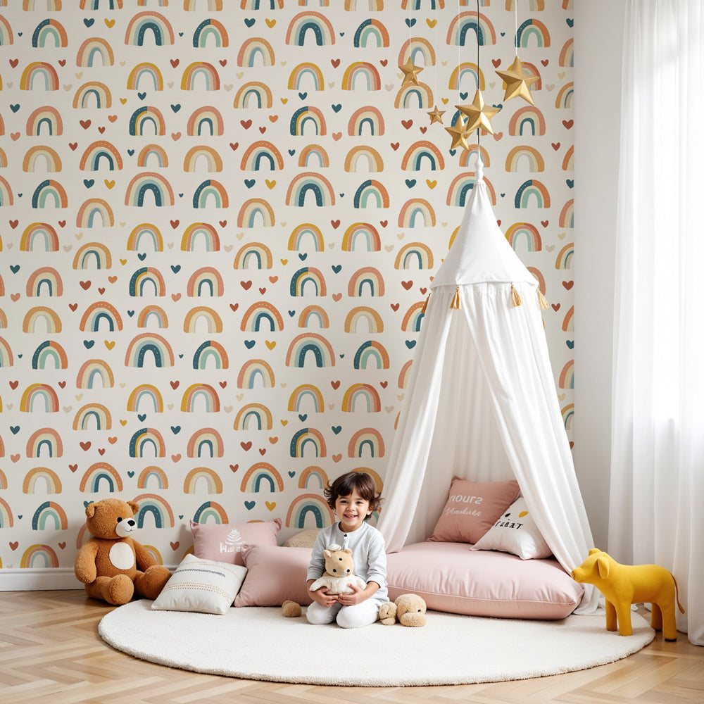 Rainbow hearts mural wallpaper in bright children's nursery with wooden crib by Kids-Mundo