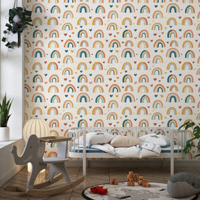 Children's rainbow hearts wallpaper in playful room setting with pastel decor