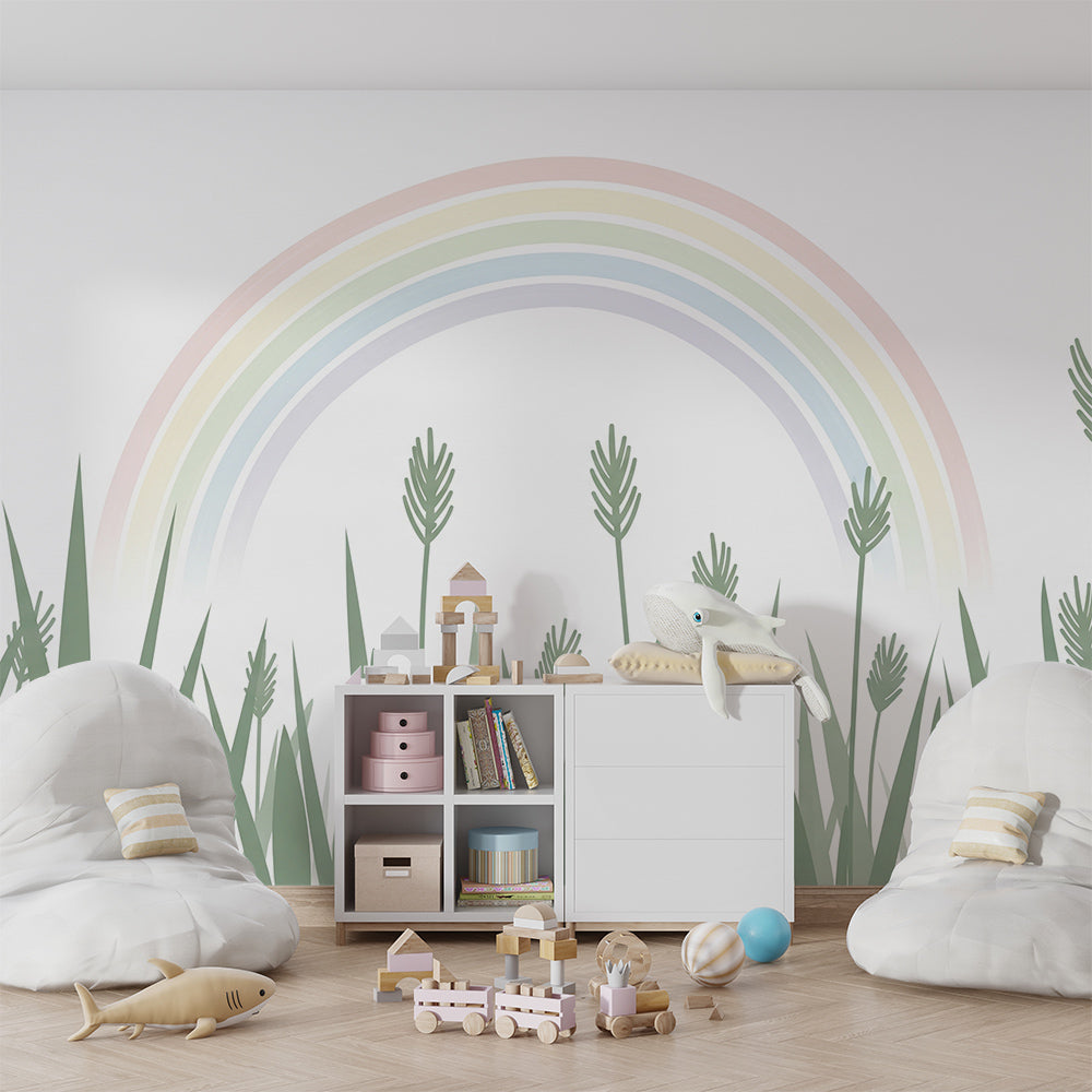 Kids-Mundo rainbow meadow wall mural behind a bed in a soft, modern kids bedroom