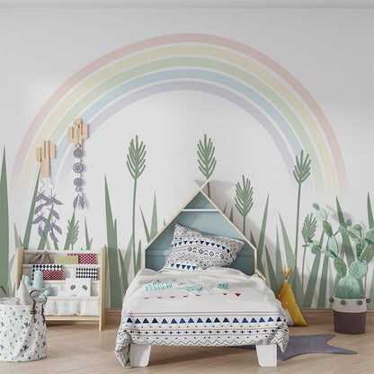 Kids-Mundo rainbow and grass wall mural covering a feature wall in a bright playroom