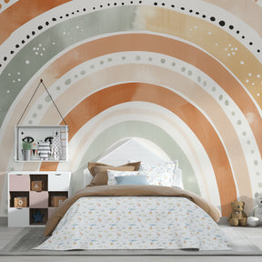 Bohemian rainbow mural wallpaper complementing wooden crib in serene nursery setting