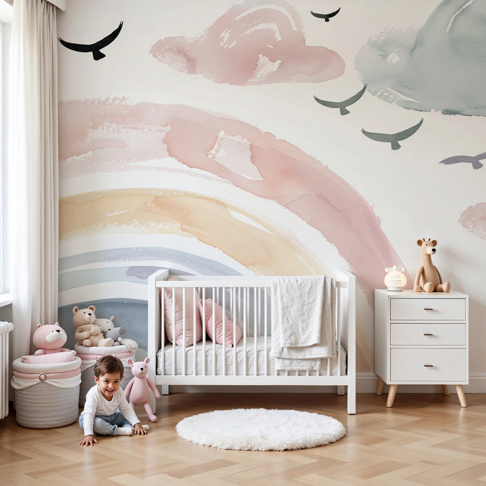 Watercolor rainbow mural wallpaper with clouds and birds in modern baby nursery by Kids-Mundo