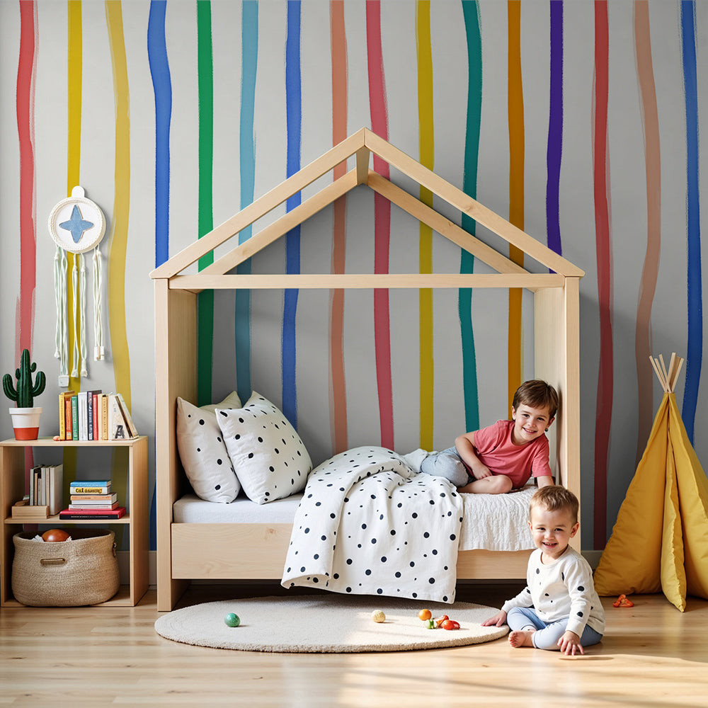 Rainbow stripe wall mural by Kids-Mundo styled in a bright, playful nursery room